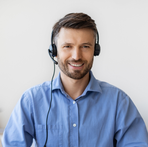 portrait-of-smiling-male-customer-service-operator-2023-11-27-05-22-13-utc-1.jpg